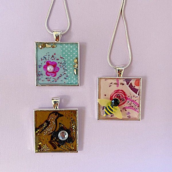 epoxy pendants made with reuse greeting cards