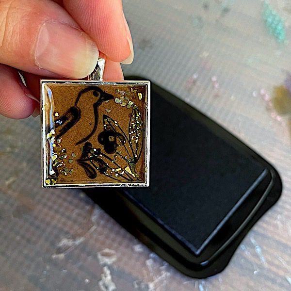 stamped bird on clear epoxy