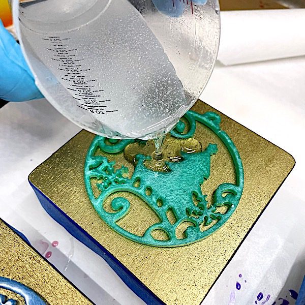 adding a clear resin layer to a coaster