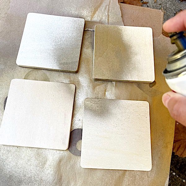 painting wood coasters with gold paint