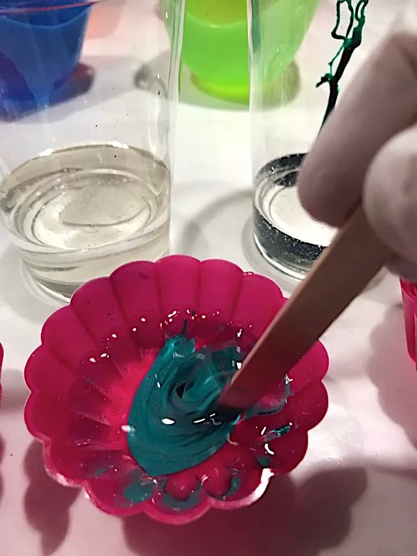 stirring color into resin